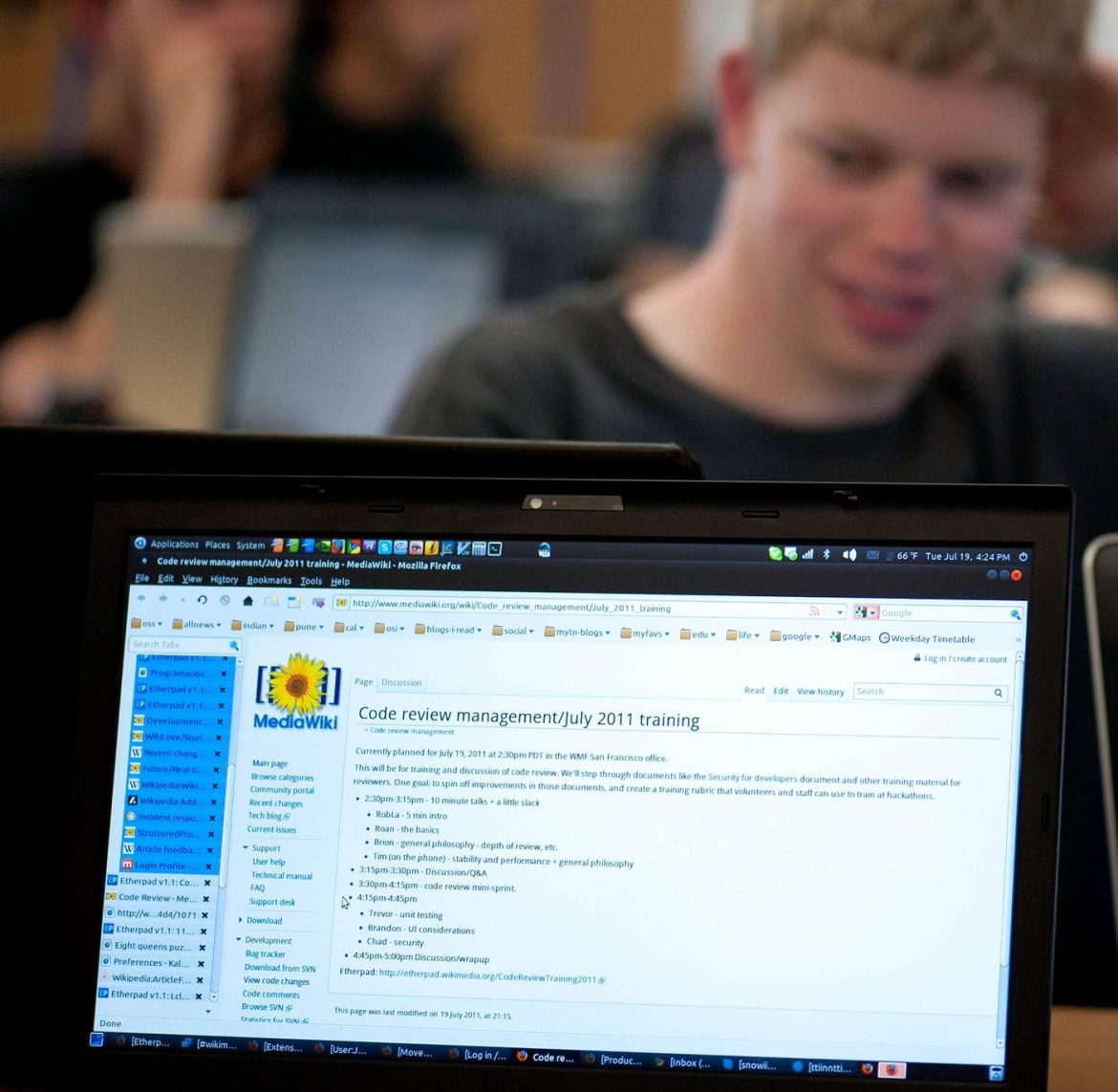 programmer reviewing code on a monitor