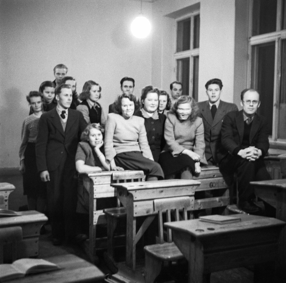 Pupils studying at desks in a Finnish school classroom.