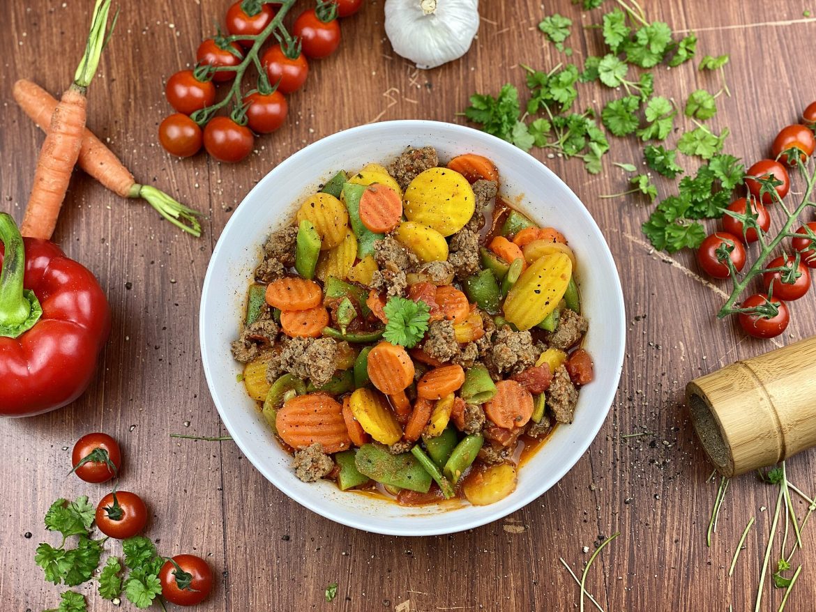 A bowl of colourful vegetables and healthy whole foods