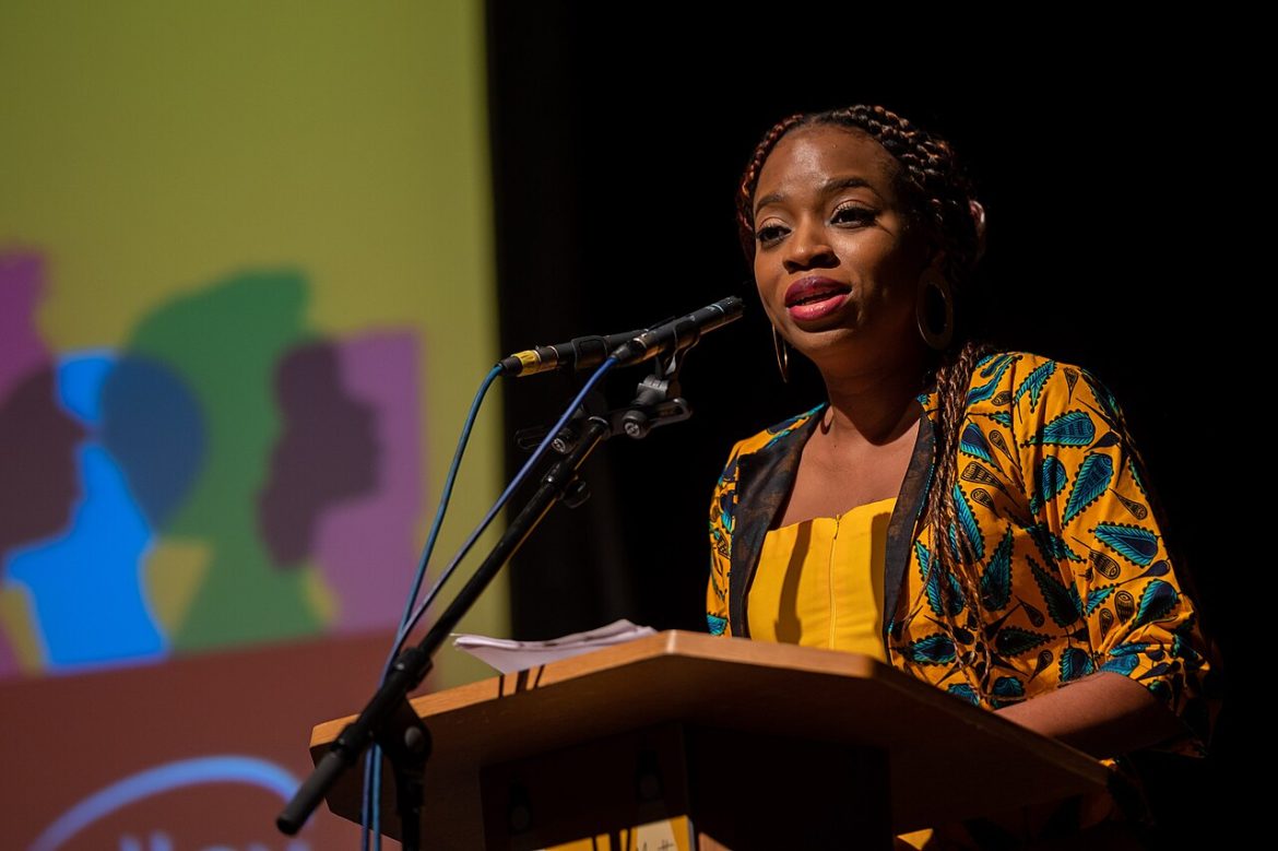 Keynote speaker addressing an audience from a lectern